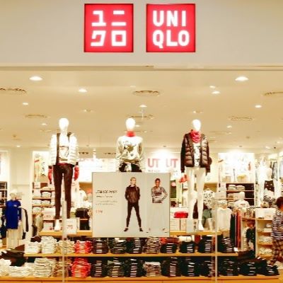 Uniqlo owner raises outlook